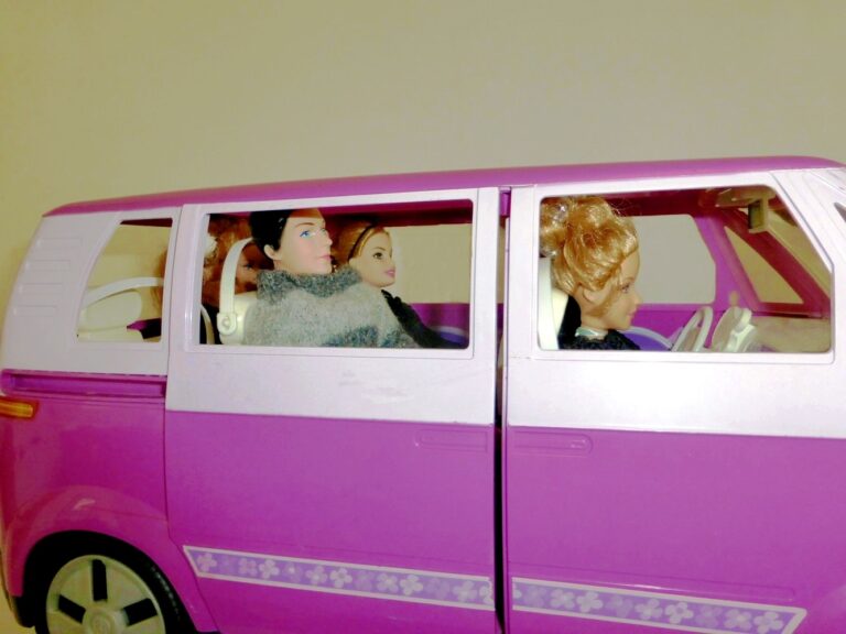 Dolls sat in VW style tour bus