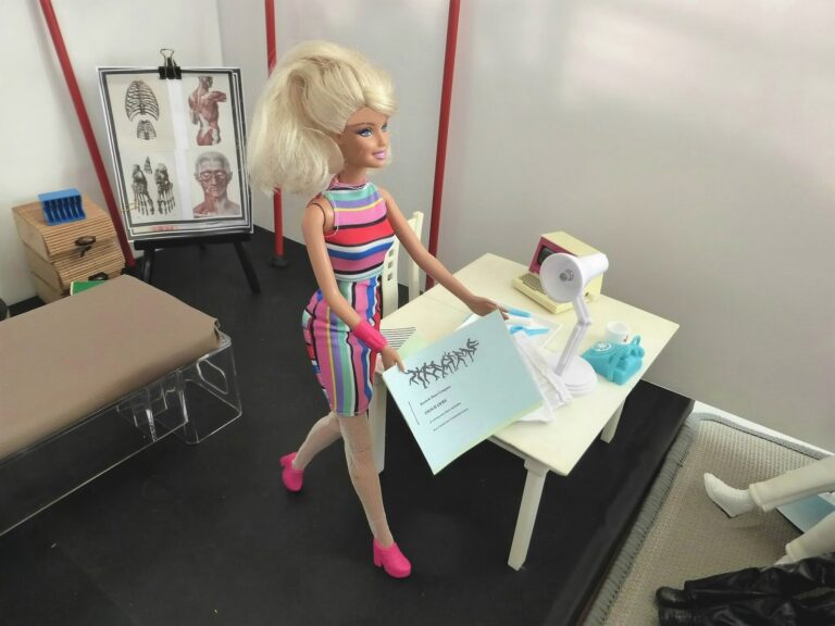 Barbie doll standing on a stage theatre set